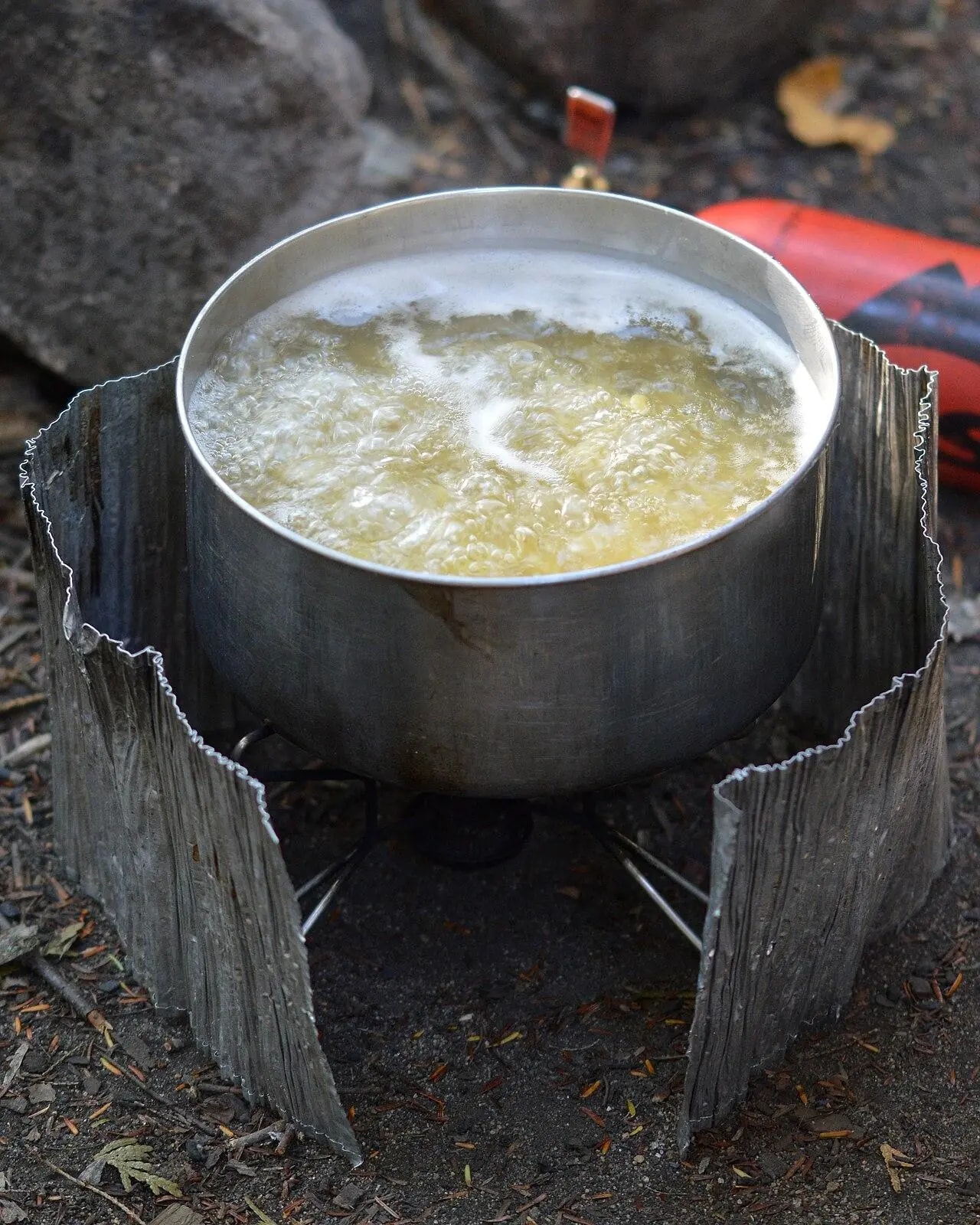 A pot of water on a camp stove